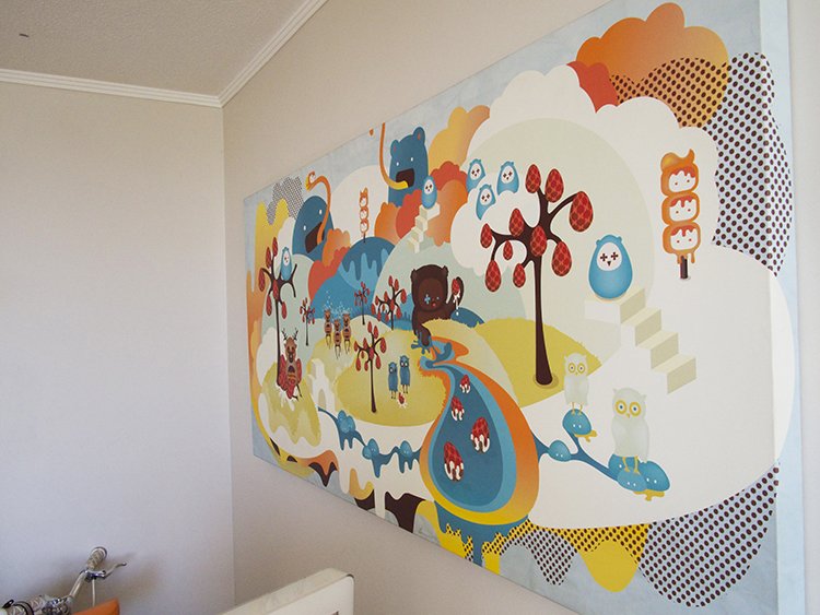 One of Pamela's digital illustration is hanged on her studio's wall.